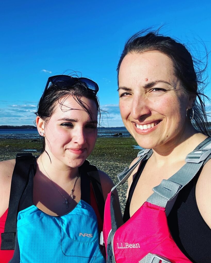 Amy and Kylie getting ready to go out on their standup paddleboards