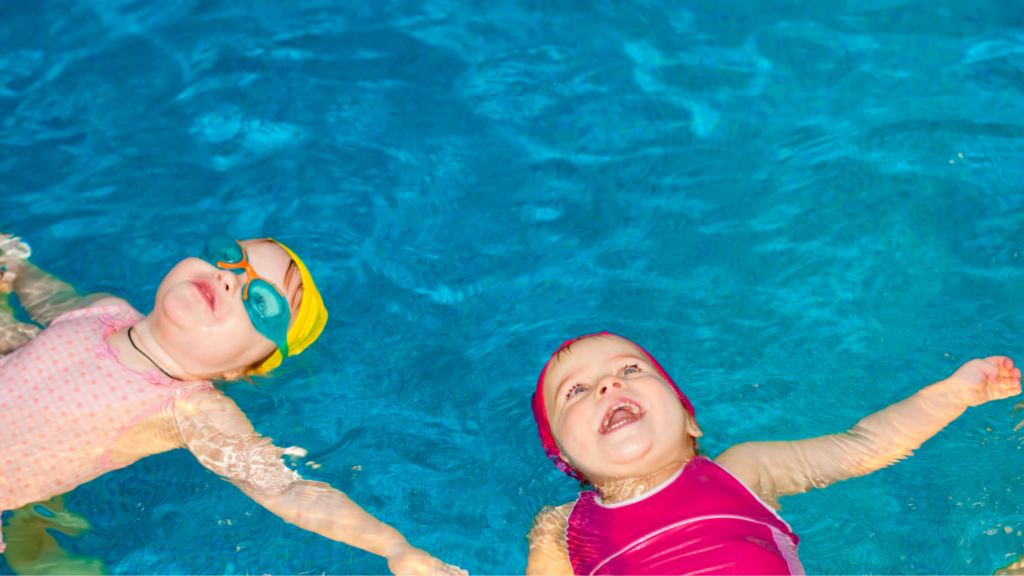 Two kids floating in a pool